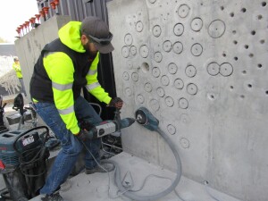 This SDS-max rotary hammer is teamed with a dust collection system for drilling cores.