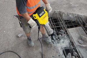 Breaker or demolition hammers are the biggest hammers but are too heavy for vertical surfaces.  